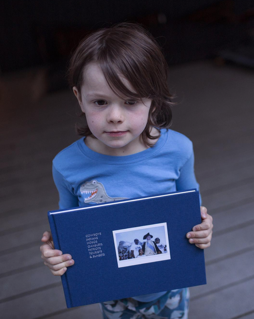 Hawkeye Huey with his first book ©Aaron Huey